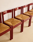 glossy red Carimate dining chairs by Vico Magistretti for Habitat