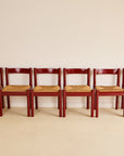 glossy red Carimate dining chairs by Vico Magistretti for Habitat