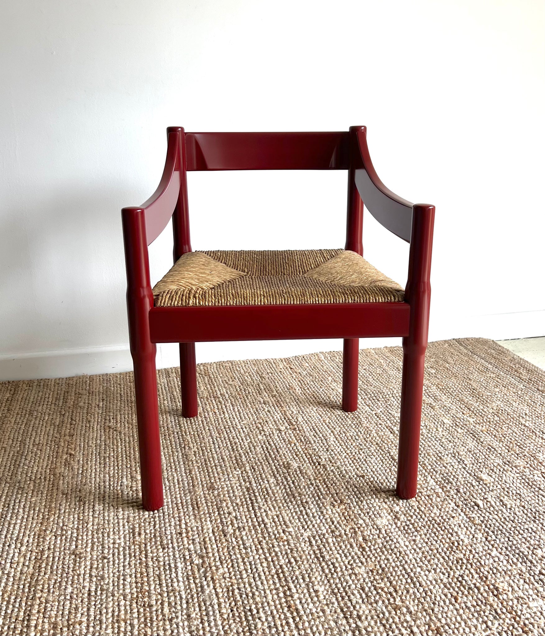 Oxblood Carimate Carver Chair by Vico Magistretti