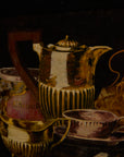 Gilded Still Life – Moody Vintage Oil Painting of Tea Service & Curiosities