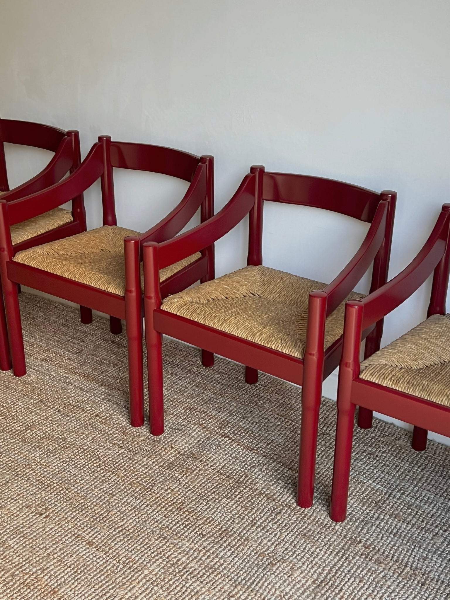 Set of x4 Oxblood Carimate Carver Chairs by Vico Magistretti