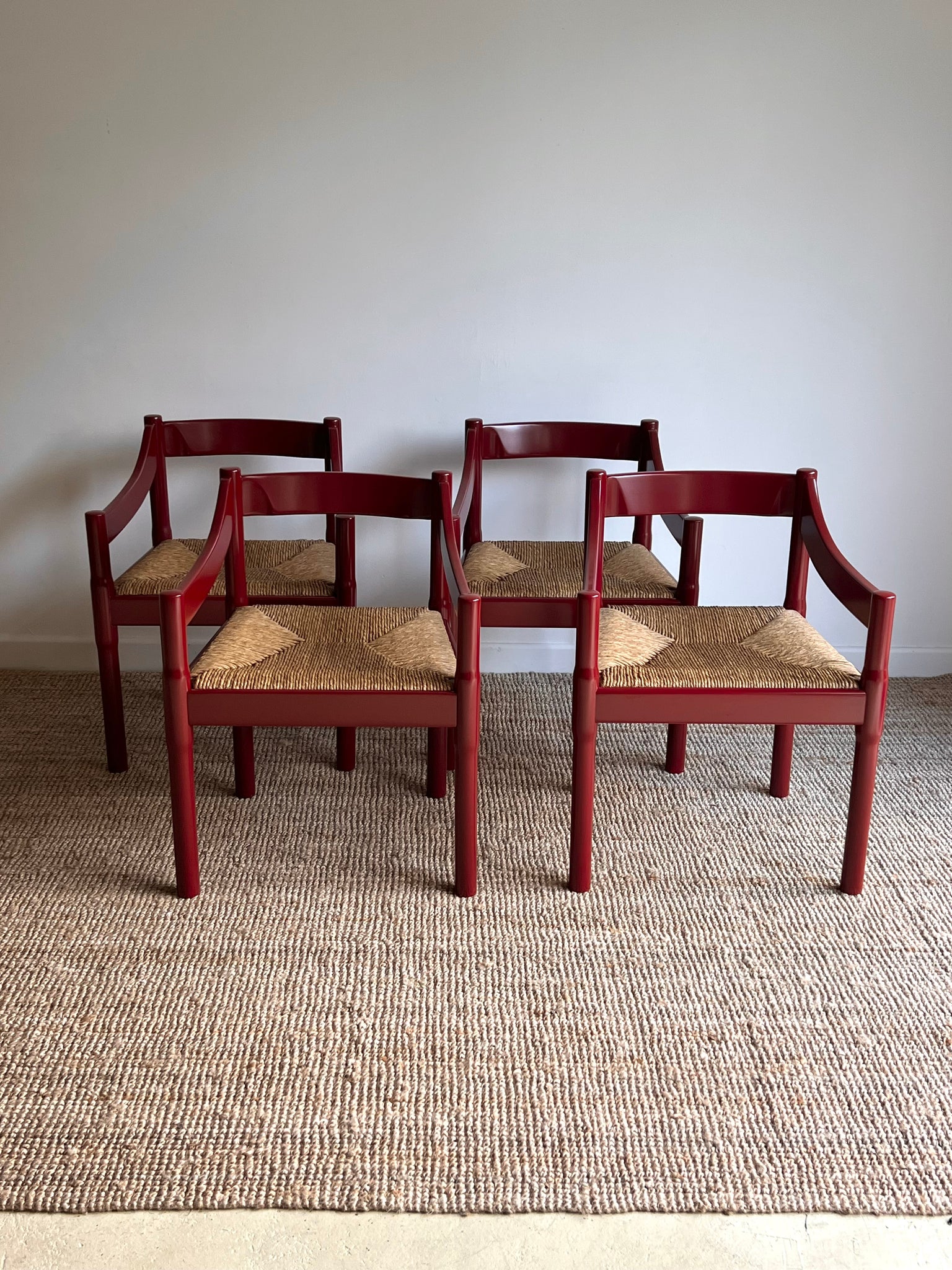 Set of x4 Oxblood Carimate Carver Chairs by Vico Magistretti