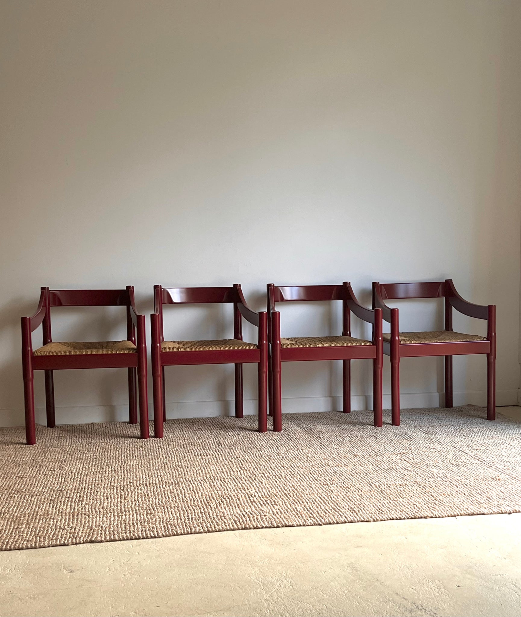 Set of x4 Oxblood Carimate Carver Chairs by Vico Magistretti