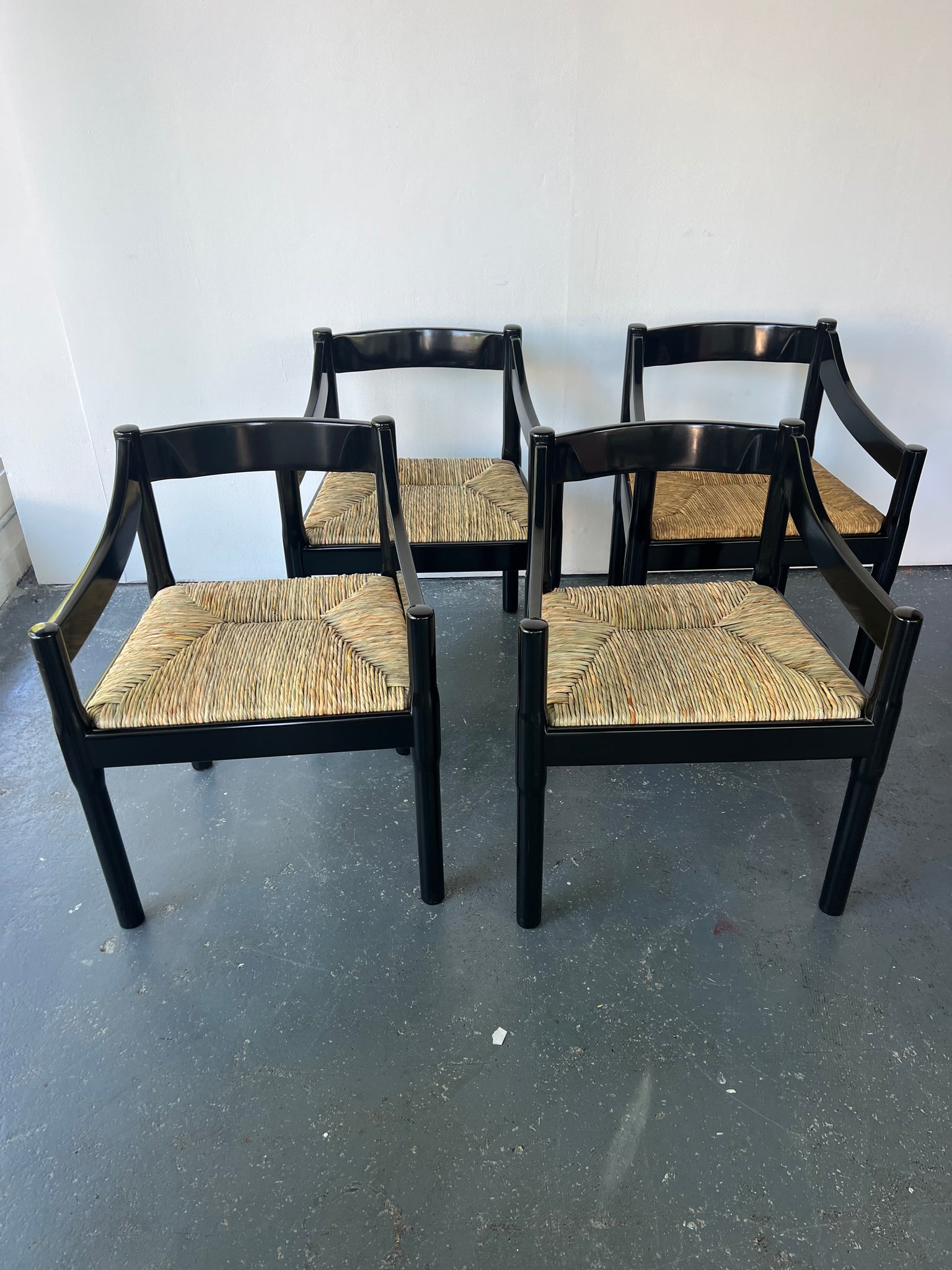 Set of x4 Glossy Black Carimate Carver Chairs by Vico Magistretti